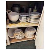 Cupboard full of white dishes
