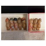 Eight celluloid Army kewpie dolls