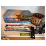 Danielle Steel books, crossword puzzle books and an Amazon Fire Stick
