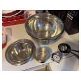 Stainless steel mixing bowls and dry measuring cups