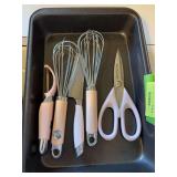 9x13 casserole dish with pink handled KitchenAid  utensils