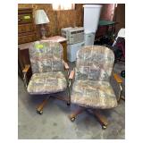 2 rolling swivel dining chairs, probably old Chrome Craft