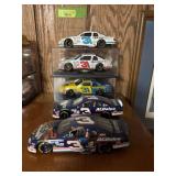 Five 1:24 scale die cast cars as shown