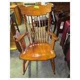 Antique pressed back arm rocker with spindle back, has pads but they hide the beauty of the wood and design of chair