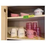 Starbucks coffee cups, pink plastic juice glasses, pink heart shaped soufflés and a little tiny pan