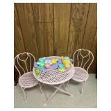 Child size pink painted metal patio style table with two chairs and tea set