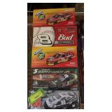 Five 1:24 scale die cast cars as shown