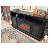 20D x 60L x 32H media center w built in fireplace  Tested and works