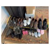 Shoe rack w men’s and women’s shoes Look like men’s size 11 and women’s 7.5