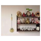 28” long wall shelf and contents plus two frilly dolls sitting on the floor