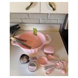 KitchenAid kitchen items includes timer, strainer, tongs, measuring cups