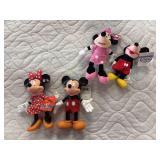Two hard plastic and two plush Mickey and minnie toys