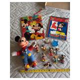 Mickey marker pad, bag, stuffed toy, and plastic collectibles
