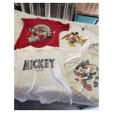Four Mickey shirts