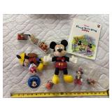 Mickey Mouse yearbook, stuffed toys, pin, and collectibles