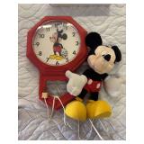 Mickey Mouse wall clock and stuffed Mickey