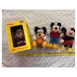 Three stuffed Mickey Mouse toys and Kellogg’s Mickey Mouse bobble head in original box