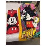 Two Mickey Mouse beach towels