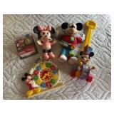 Vintage Mickey Mouse children’s toys, including popper, clock toy, farmer Mickey plastic squeeze toy, and stuffed Mickey