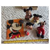 Mickey Mouse folder, pin, and various toys
