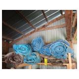 Plethora of plastic tarps, approx 8, condition unknown Plethora of plastic tarps, approx 8, condition unknown
