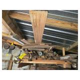 Various lumber on ceiling rack and floor Various lumber on ceiling rack and floor
