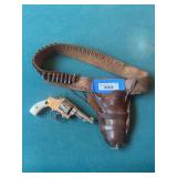 Smith and Wesson 32 long serial #235483 pearl handle revolver with ammo belt holster