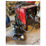 Century 130 mig wire feed welder with two argon tanks and welding clamps Century 130 mig wire feed welder with two argon tanks and welding clamps