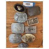 Three National Finals Rodeo belt buckles, and other western buckles