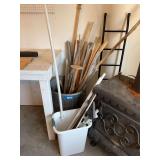Galvanized trash can, full of miscellaneous handles, metal curtain rods etc