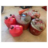 Three metal and three plastic gas cans