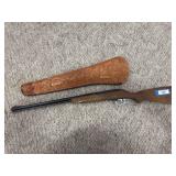 JC Higgins .22 caliber rifle with tooled leather scabbard