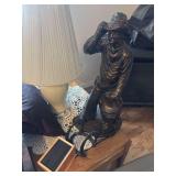 Plaster cowboy sculpture, Louis LaMoure book on cassette