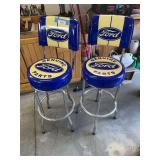 Two Ford swivel shop stool