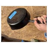 Hammered cast-iron skillet marked 85E