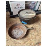 Large unmarked Dutch oven and large unmarked cast-iron skillet