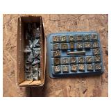 Two sets of leather stamps