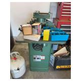 Grizzly three-quarter inch wood shaper with lots of shaping bits and clamp