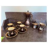 Unmarked tea set with 4 cups & saucers, pitcher, cream & sugar