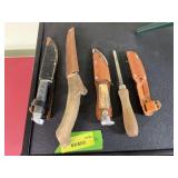 3 hunting knives and tool