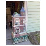 Victorian house styled shelf unit w/ door 22" wide x 55" tall See photos for condition, has some minor damage