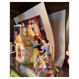 Snow White group includes figurine, teapot, coffee cup, VHS tape, 1994 commemorative lithograph