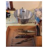 Expandable wire rack, angel food pan, various knives