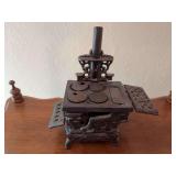 Unmarked cast iron mini cookstove 8" wide x 8.5" tall