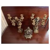 Winged cherub candlesticks and modern metal clock
