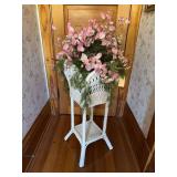 Wicker planter with pink flowers