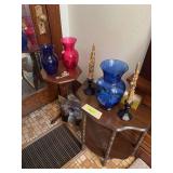 Vases, blue candle holders, two side tables and a picture of a Victorian lady