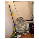 Two oval woven rugs, cleaning supplies, iron, etc