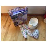 Potty chair, purple sit and snack booster seat, and cloth doll