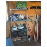 Metal shelf with garden items and a few garden hand tools